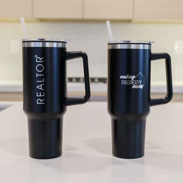 Woman holding pink "Orange County Realtors" tumbler